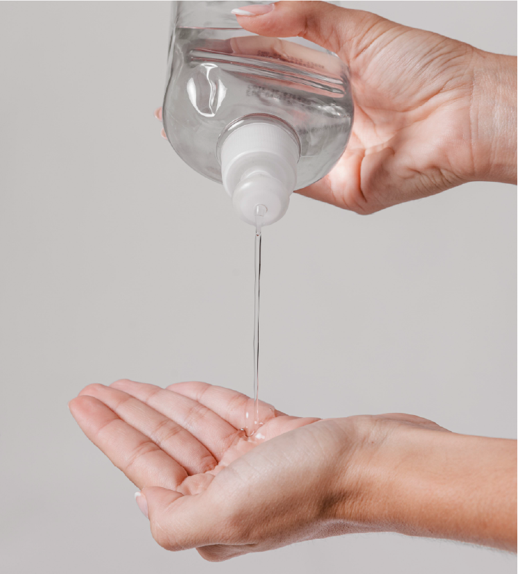Isopropyl Alcohol in use: controlled pouring for industrial cleaning applications.